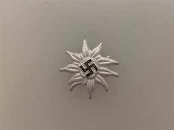 S.A. or S.S. mountain troops metal edelweiss badge