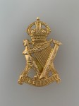 Royal Irish Rifles metal cap badge. Brass WW1 Economy issue.